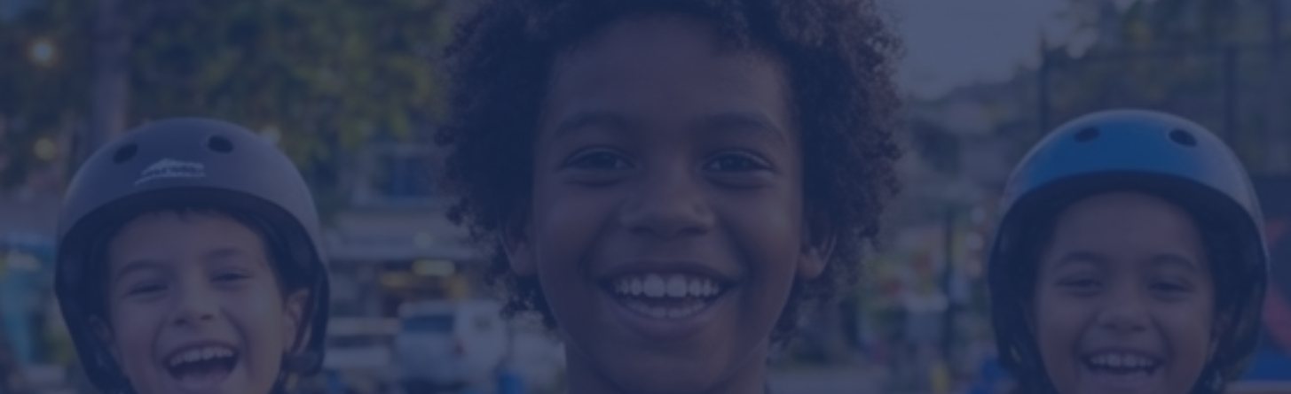 Smiling kids in skate helmets